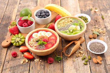 assorted smoothie bowl with muesli and berries