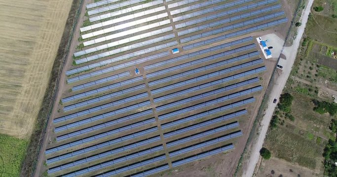 Panoramic view of a solar power plant, rows of solar panels, solar panels, top view, Aerial view to solar power plant, Industrial background on renewable resources theme, power station, top view,