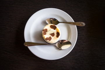 Fresh Japanese Cheesecake on white plate on wooden table background