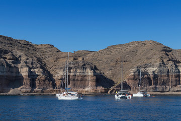 Bay of santorini with catamaran in the water