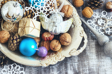 Christmas Composition of balls, cones and snowflakes in a metal bowl. Vintage style. toning