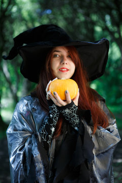 Close-up picture of witch with pumpkin