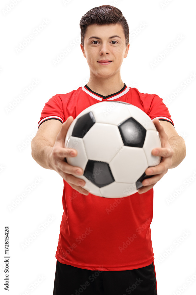 Sticker Teenage soccer player giving a football