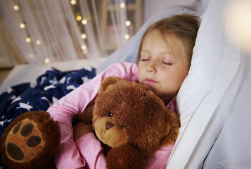 Small girl sleeping with teddy bear © gpointstudio