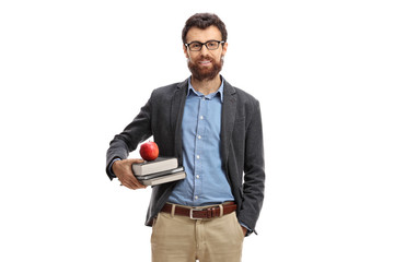 Teacher with an apple and books looking at the camera