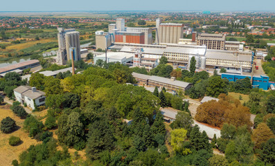 Obraz premium Aerial view of industrial cityscape with factory buildings, dron