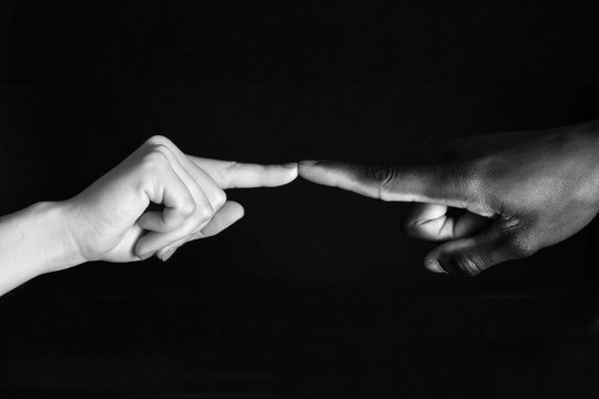 Detail of finger african and caucasian, man and woman