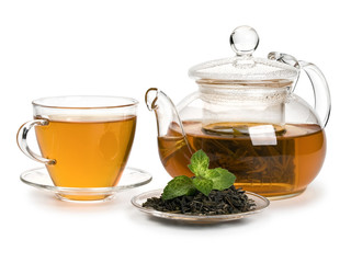 Tea leaves of green tea with petals of fresh mint and a tea drink in glassware