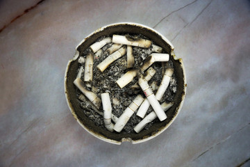 Ashtray with cigarette butt