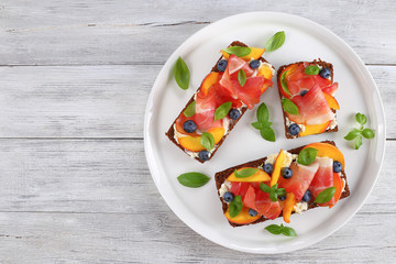 open sandwiches with cream cheese, meat