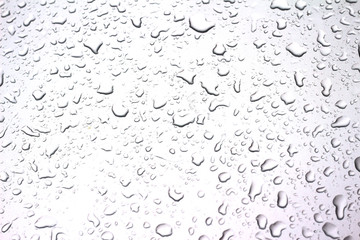 drops of water on car after rain, background with copy space