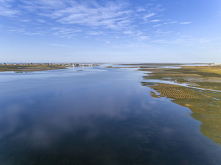 Aerial seascape, in Ria Formosa wetlands natural park, over Cavacos beach. Algarve.
