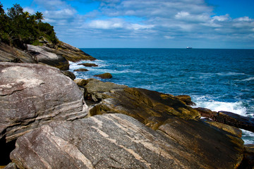 High angle view rocks, sea and sky of Brazil beach.