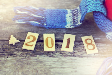 warming atmosphere 2018/ red mug in blue scarf with wooden fir tree and number