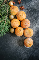 Set of vanilla muffins with chocolate cream filling. Blue stone background.