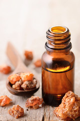 myrrh essential oil on the wooden board