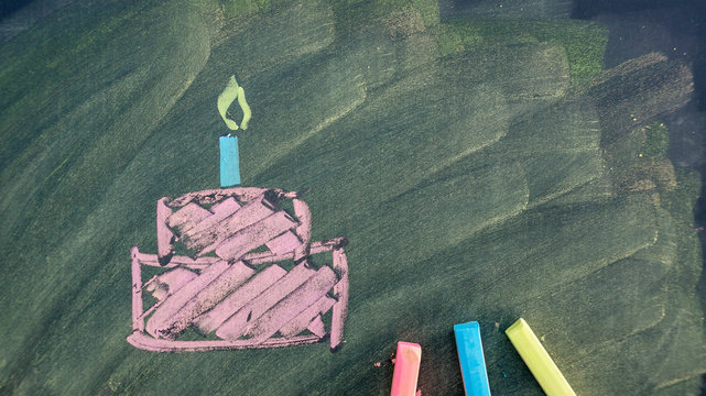 Draw A Birthday Cake Picture By Chalk Pastels On A School Blackboard.