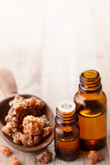 myrrh essential oil on the wooden board