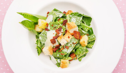 close up of caesar salad on a table.