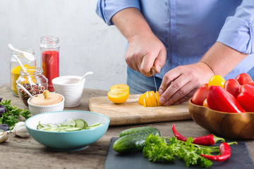 man cooking a vegetarian salad