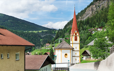 Fototapeta na wymiar Church on the background of the Alps