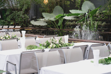 a hotel prepared for wedding ceremony in the garden. 