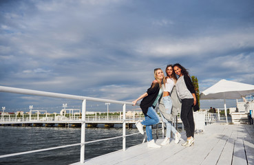 Beautiful smiling girls posing photographer. Positive emotions