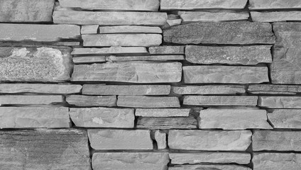 Stone wall texture, slim briks. Gray brick wall background.