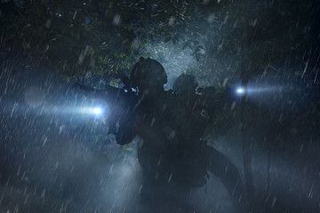 Special Forces soldiers in action. Elite squad moves through fog and smoke.