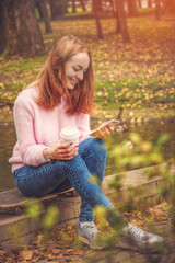 girl is sitting on a skateboard