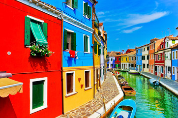 View of the colorful Venetian houses along the canal at the Islands of Burano in Venice.