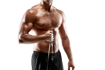 Portrait young sexy handsome man of strong athlete's body with bare torso. Posing on white studio background