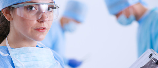Young surgery team in the operating room . Operating room