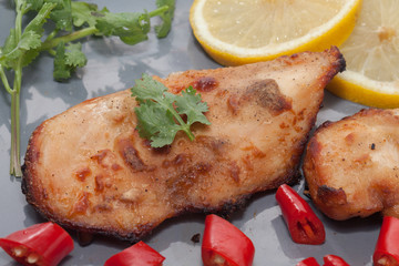 Roast chicken with chilli, lemon on plate