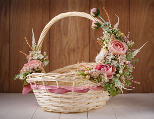 Fototapeta na wymiar Decorative Easter basket with flowers