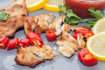 Roast chicken with chilli, lemon on plate
