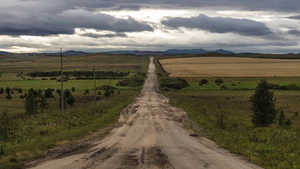 A dirt road leaving into the distance.