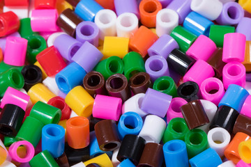 
colored plastic pipe pieces