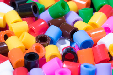 
colored plastic pipe pieces