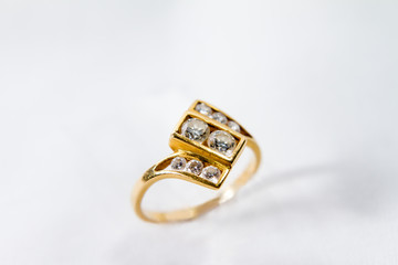 Diamond engagement gold ring with white isolated background