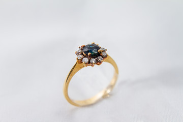 Sapphire with Diamond Engagement gold ring on white isolated background