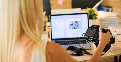 Young photographer and graphic designer at work