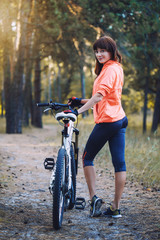 Naklejka premium cyclist cycling mountain bike on Pine forest trail