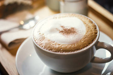 Soft focus on capuccino coffee cup, coffee for background - vintage effect process picture.