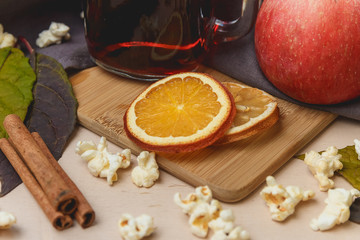 mulled wine with cinnamon. On a bright wooden background.