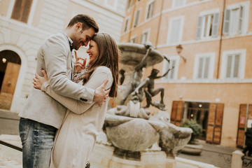 Happy loving couple, man and woman traveling on holiday in Rome, Italy