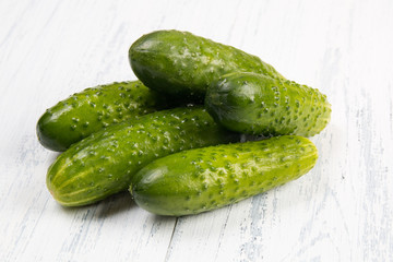 cucumbers on a white wooden background