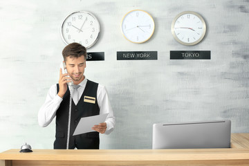 Male receptionist working in hotel