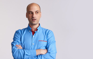 surprised bald man looking side