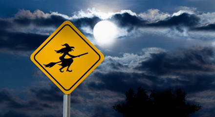 Full Moon in the Night Sky and Witch Road Sign